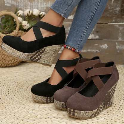 Elegant brown Serova women's wedges, providing orthopedic support & a stylish cross strap design.
