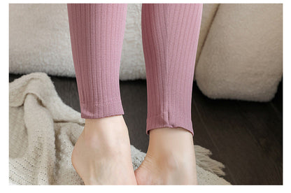 Women's thermal top, part of a shaping base layer set for warmth.