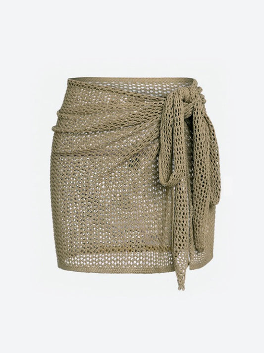 Women's sheer knit beach cover-up skirt for swimwear, ideal for vacation & resort wear.
