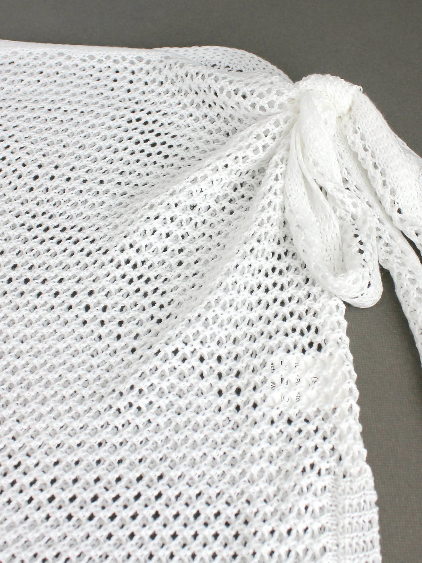 Chic women's sheer knit beach cover-up skirt, perfect resort wear for swimwear & summer vacation.