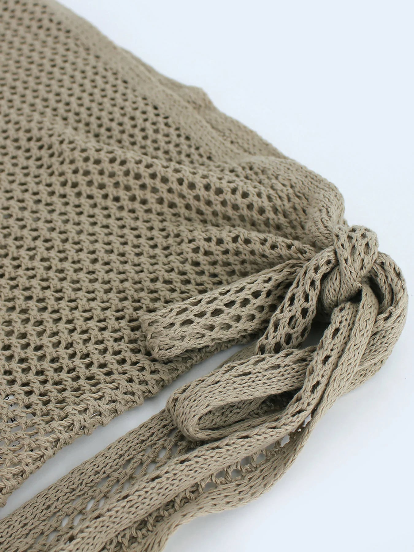 Stylish women's sheer knit beach cover-up skirt, resort wear for swimwear, vacation & summer.