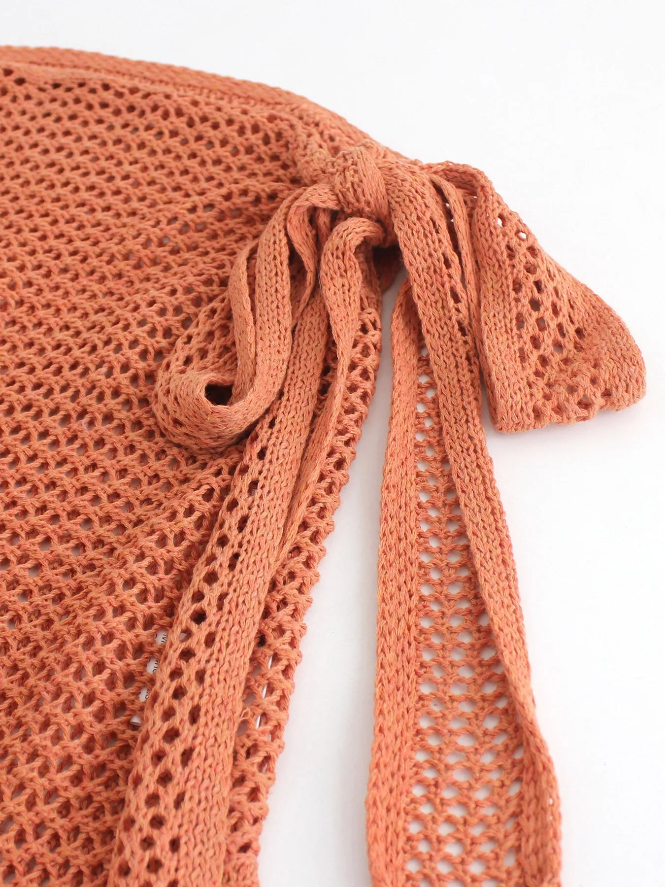 Women's sheer knit beach cover-up skirt with high slit, stylish for resort wear & summer swimwear.