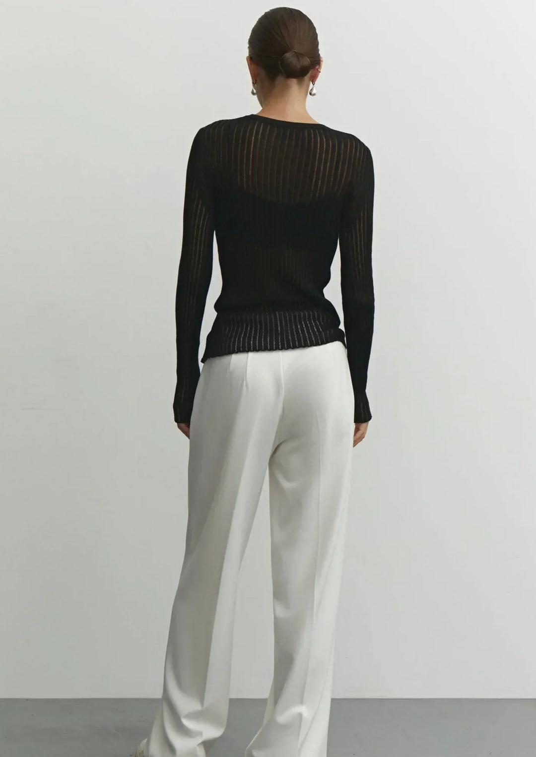 White sheer ribbed long sleeve top, an elegant women's blouse, versatile for casual or evening fashion.