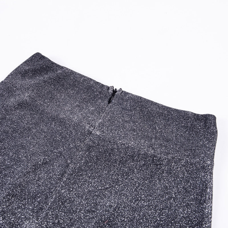 Close-up of shimmering glitter wide leg pants, highlighting the sparkling fabric and glamorous detail.