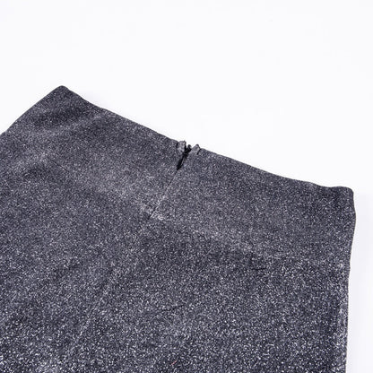 Close-up of shimmering glitter wide leg pants, highlighting the sparkling fabric and glamorous detail.
