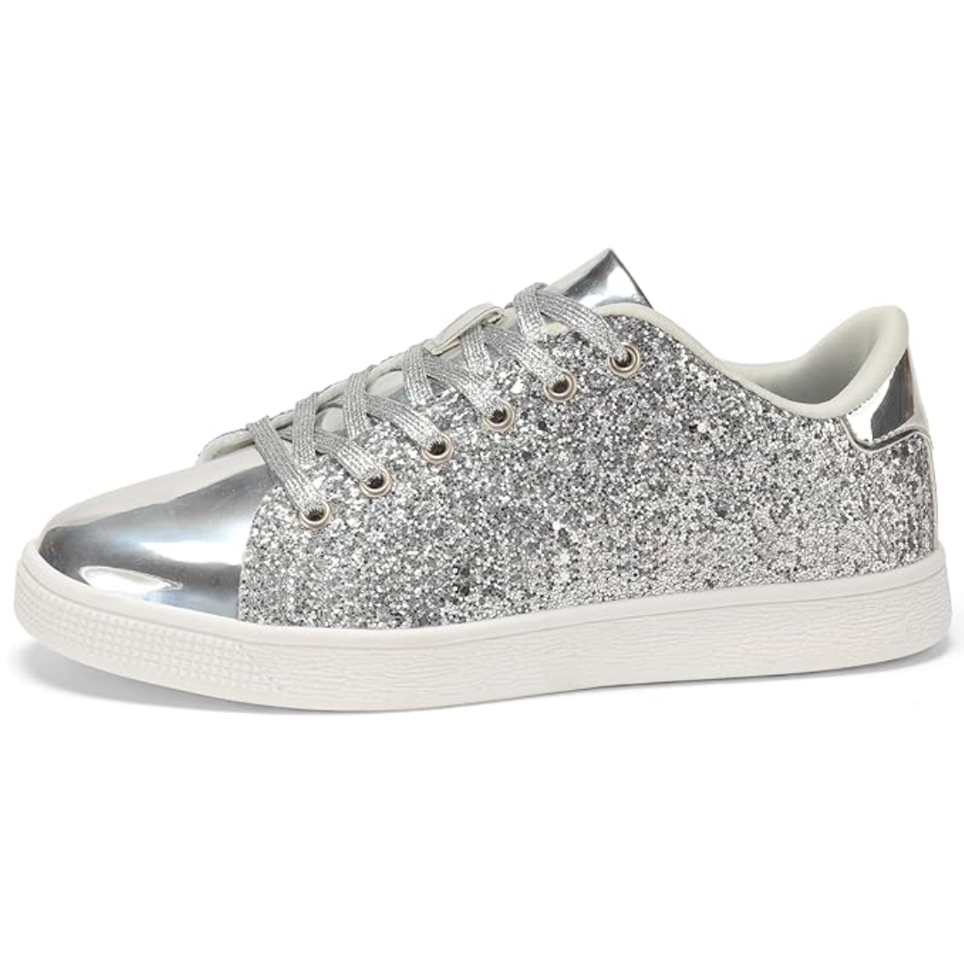 Detail shot of the laces and sparkling finish on women's trendy casual sneakers.