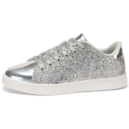Detail shot of the laces and sparkling finish on women's trendy casual sneakers.