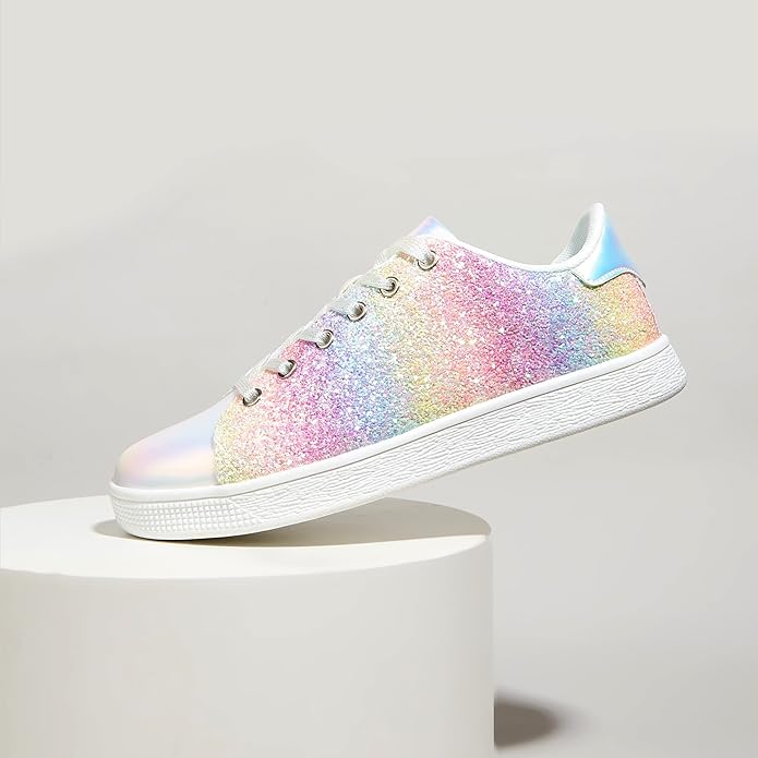 Close-up of shimmering material on women's stylish lace-up casual sneakers.
