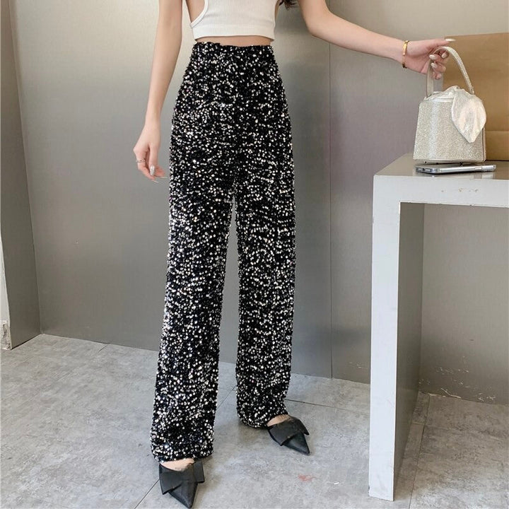 Shimmering disco pants for women, perfect festival wear. One-size, comfortable, and eye-catching.
