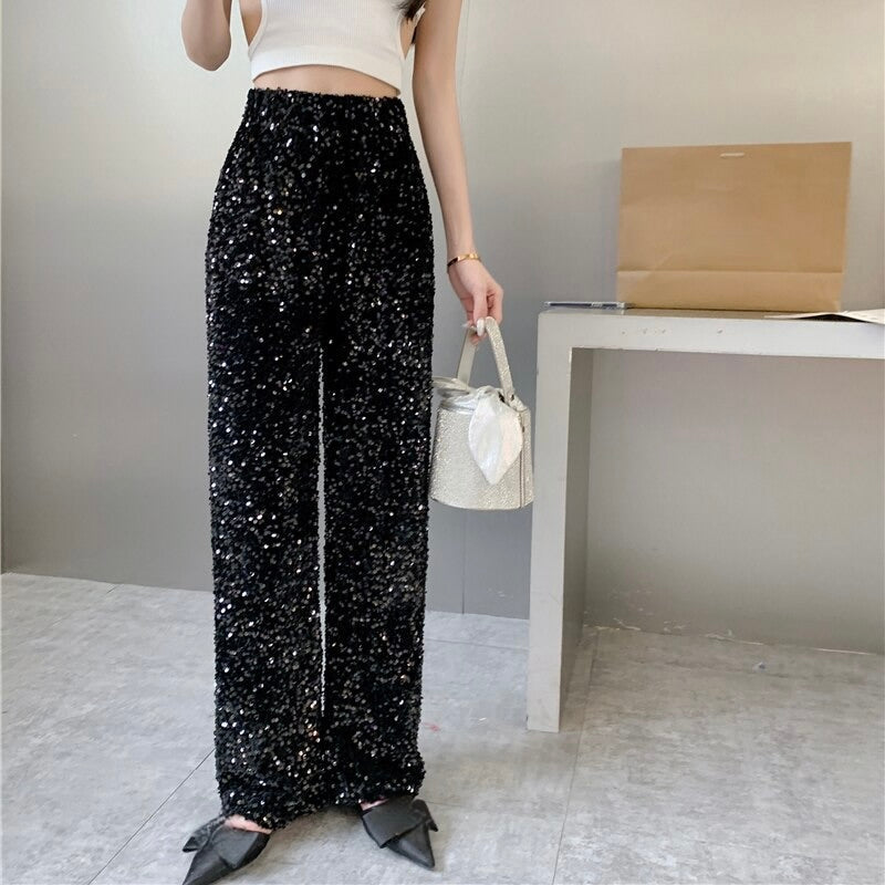 Women's shimmering party pants, one-size fits all. A glamorous and comfortable piece for any party.