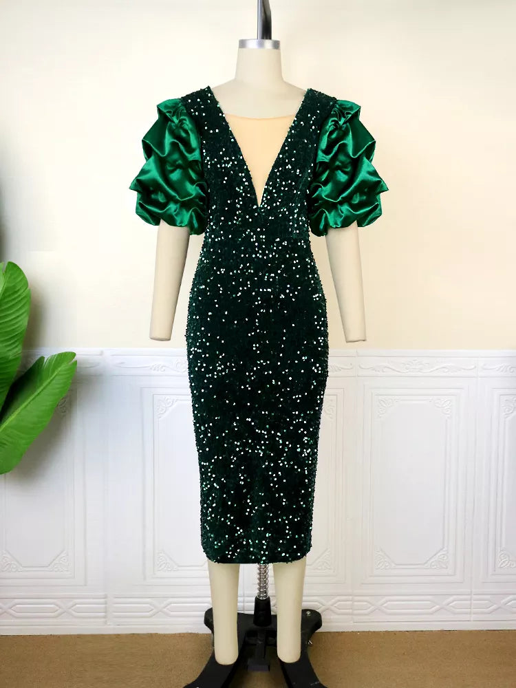 Elegant green shimmering plus-size dress featuring puff sleeves and a flattering fit for festive evening wear.