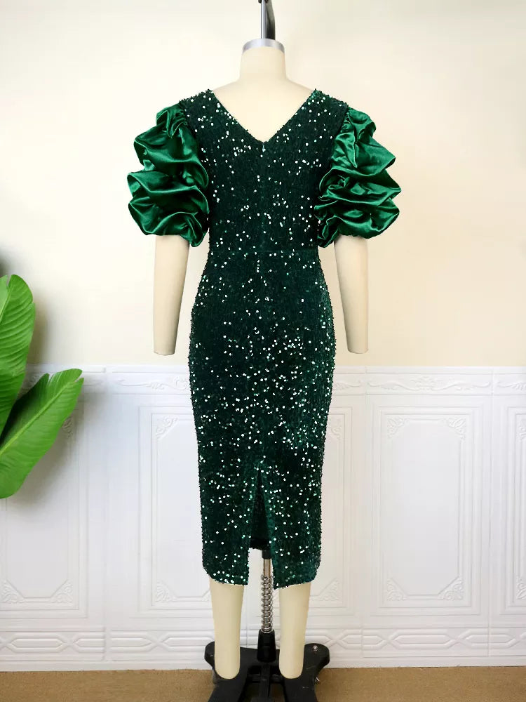 Close-up of a women's plus-size dress, highlighting the shimmering fabric and vintage-style puff sleeves.