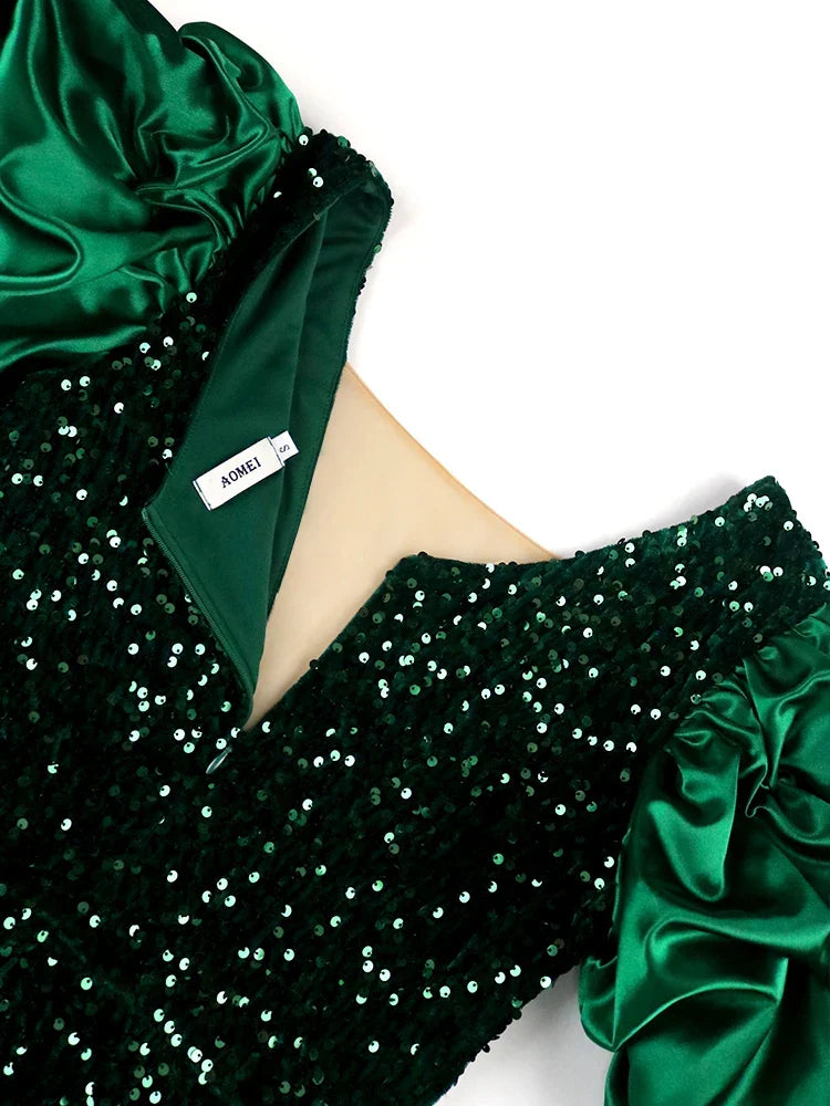 Stylish women's plus-size evening dress in shimmering fabric with elegant puff sleeves, great for parties.