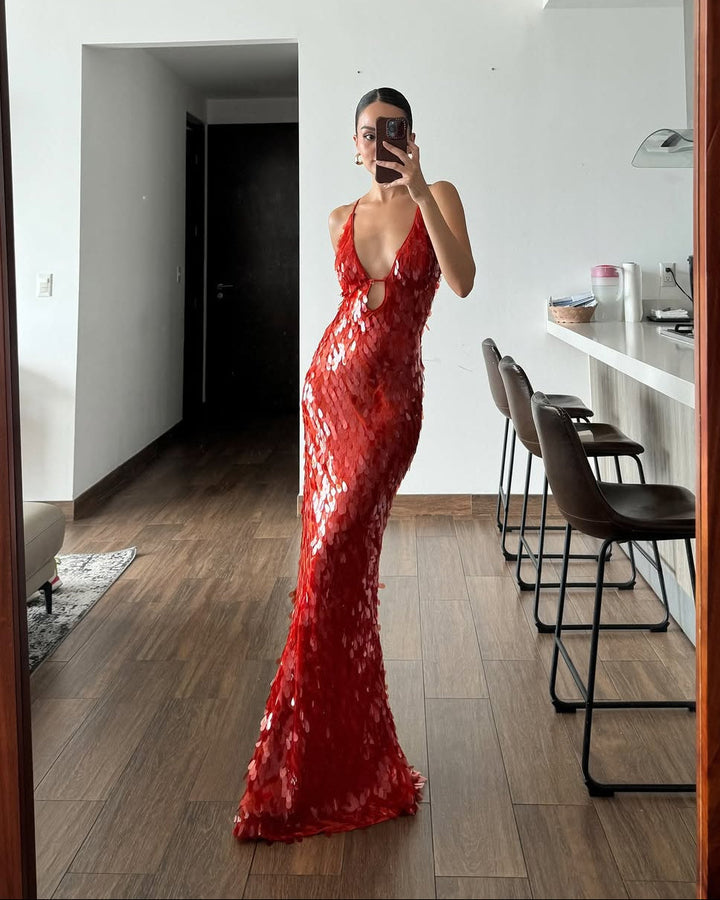Dazzling red sequin plunge formal dress for women. A glamorous evening gown or special occasion maxi dress.