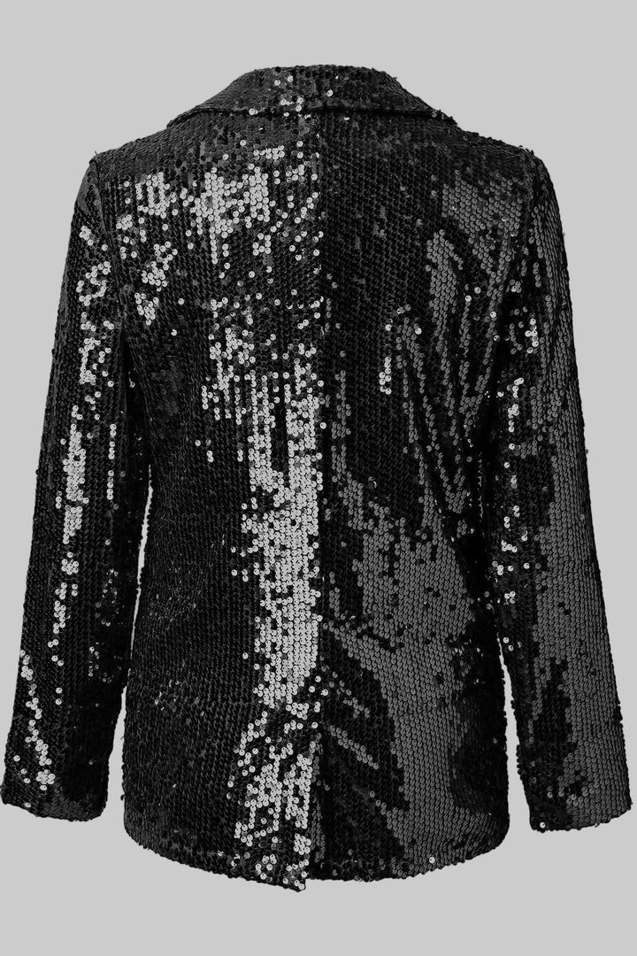 Tailored women's shimmering sequin blazer. Elegant evening wear, a glamorous party statement piece that sparkles.