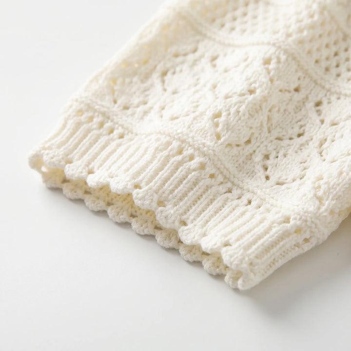 Breathable women's short sleeve crochet blouse, ideal summer wear for a comfortable, chic style.