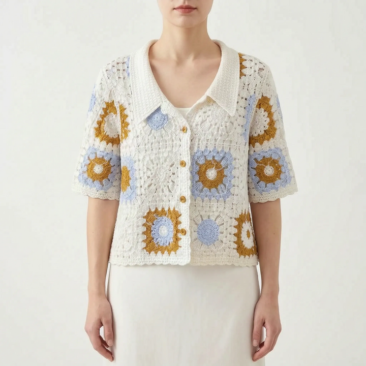 Elegant women's short-sleeve crochet cardigan with open knit and geometric pattern. Lightweight summer apparel.