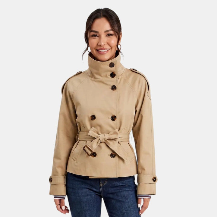 Versatile women's short trench coat with belt, a stylish spring/fall jacket for both casual and professional looks.
