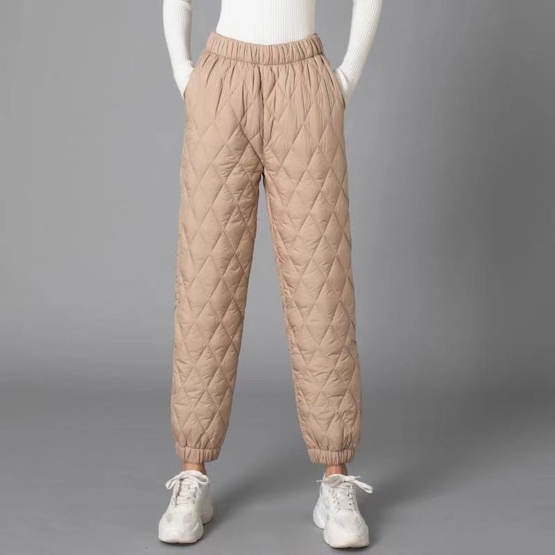 Model wearing comfortable women's Sierra quilted pants, ideal for relaxed everyday style and winter coziness.