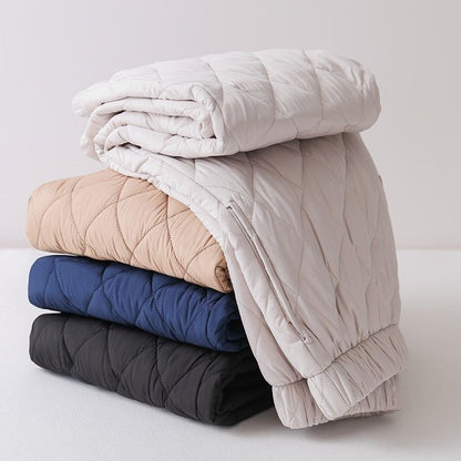 Full view of women's Sierra quilted pants, combining cozy comfort, relaxed fit, and chic diamond stitch design.
