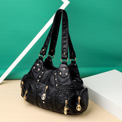 Elegant women's everyday bag in faux leather. A versatile shoulder purse and fashion accessory.