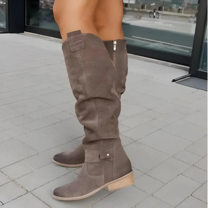Stylish women's ankle boots, versatile for dressy or casual outfits, sleek and structured.
