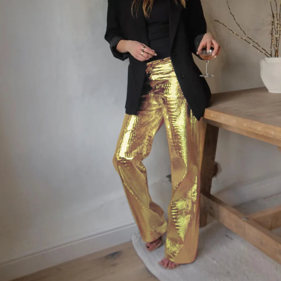 Gold women's sleek designer style party pants, ideal for a chic and glamorous evening look.