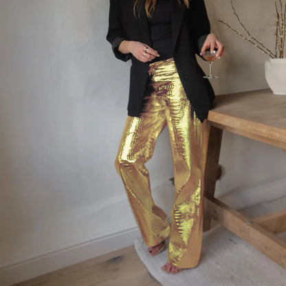 Gold women's sleek designer style party pants, ideal for a chic and glamorous evening look.