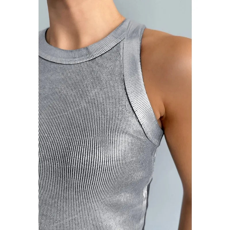 Woman wearing a sleek, comfortable everyday tank top for versatile summer style.