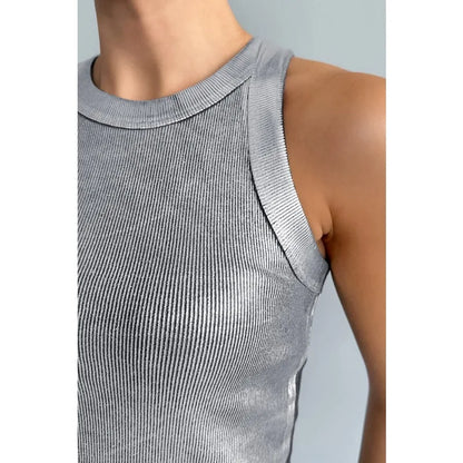 Woman wearing a sleek, comfortable everyday tank top for versatile summer style.