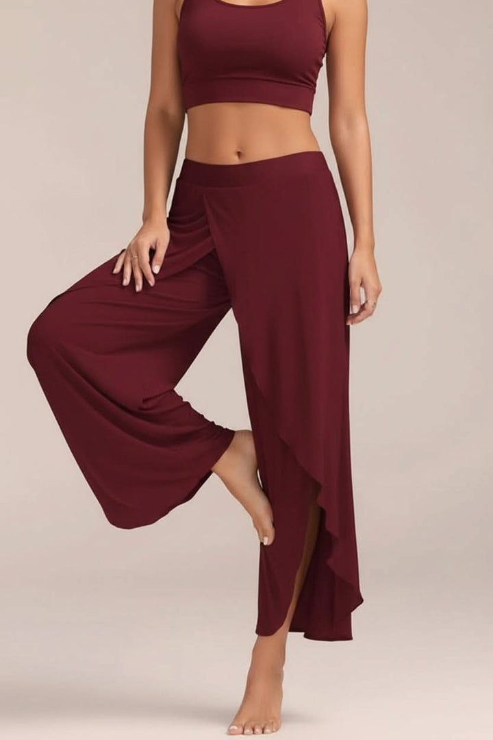 Sleek black women's high waisted yoga pants, essential athletic apparel for yoga, gym, and daily wear.