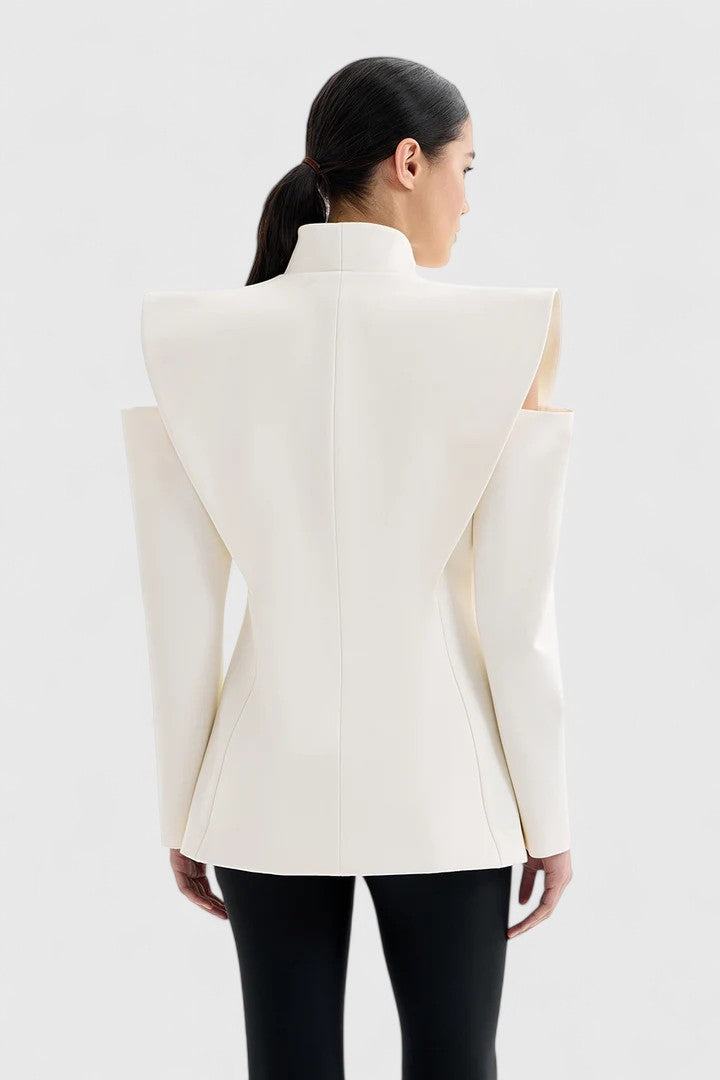 Close-up: Women's elegant ivory tailored blazer, highlighting structured shoulders & sleek fabric.