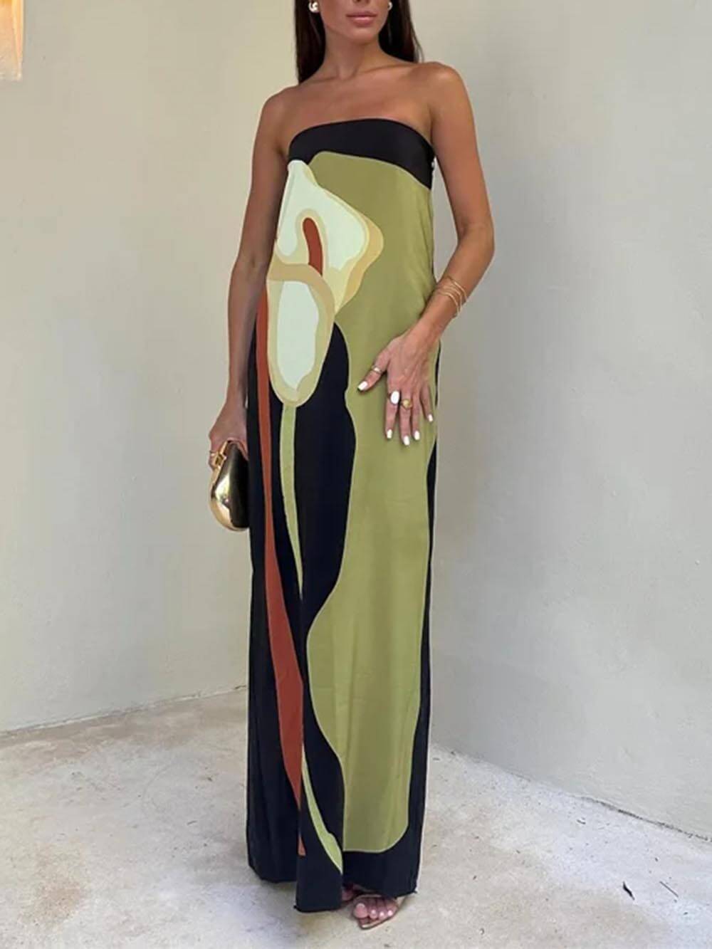 Women's sleeveless green maxi sundress, perfect for chic summer fashion and vacation wear. Elegant flowy day dress.
