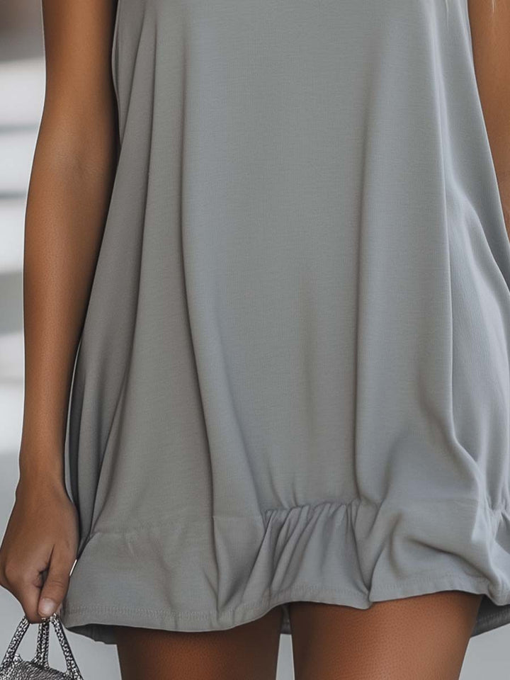Casual women's comfortable sleeveless hooded mini dress with a flirty ruffle hem, great for warm weather.