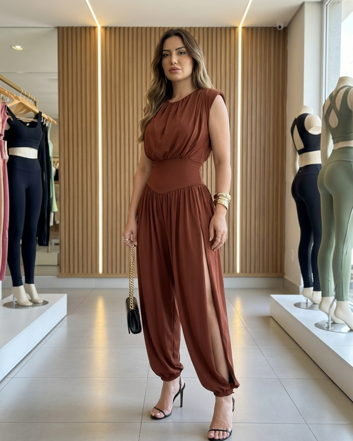 Women's sleeveless jumpsuit with cinched high waist & elegant balloon legs. Perfect for evening wear.