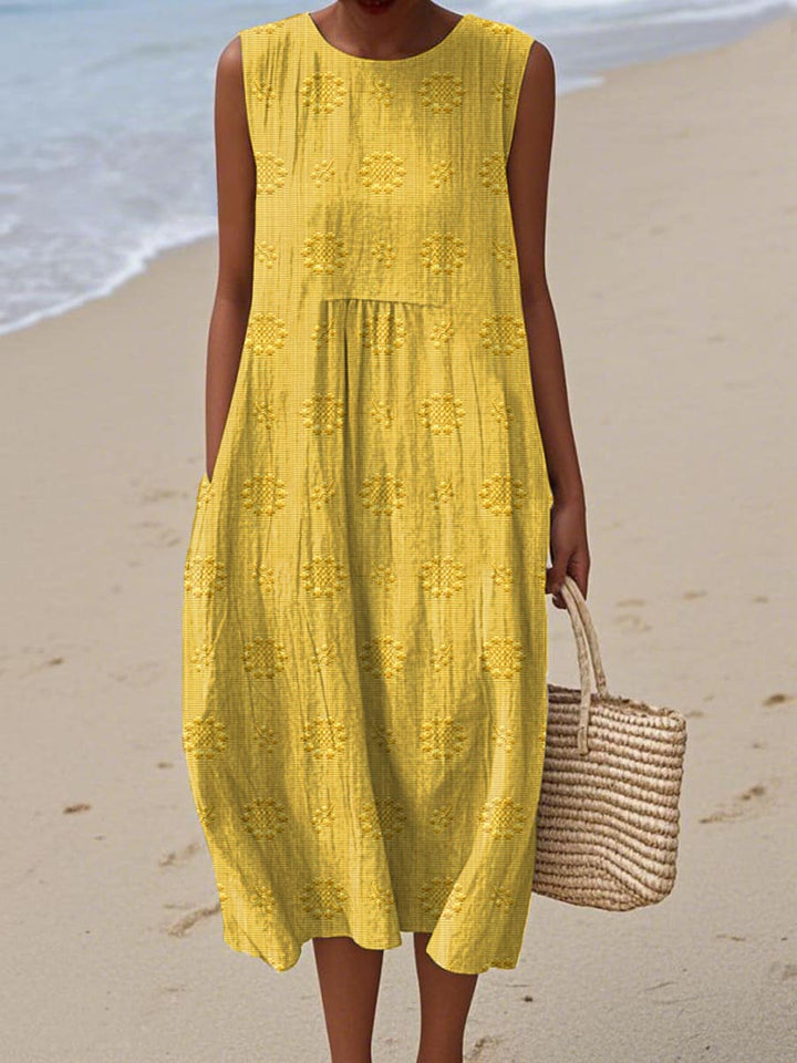 Casual women's sleeveless midi dress with pockets, excellent for everyday wear, travel, and warm weather adventures.