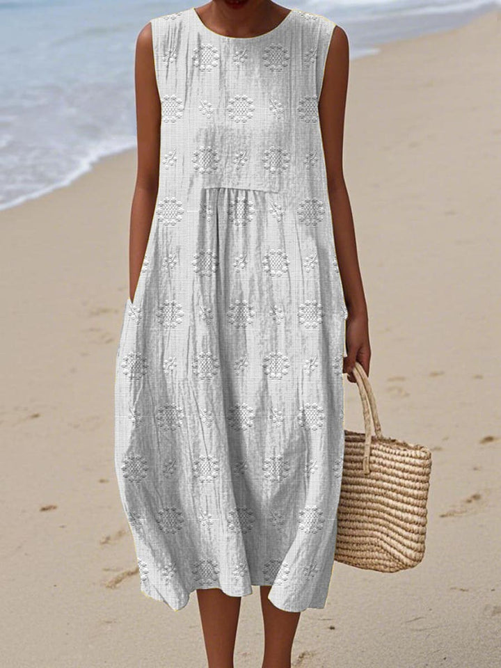 Comfortable women's sleeveless midi summer dress with pockets. A versatile and breathable choice for warm-weather fashion.