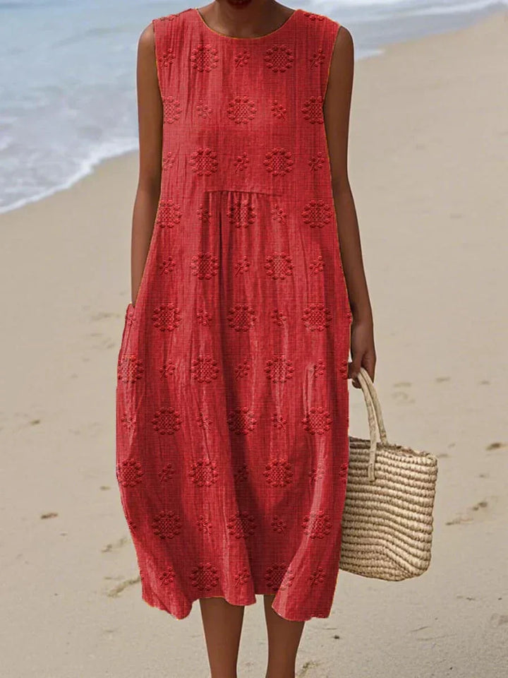 Elegant women's sleeveless midi dress with pockets. Perfect for summer, casual outings, or a comfortable everyday look.