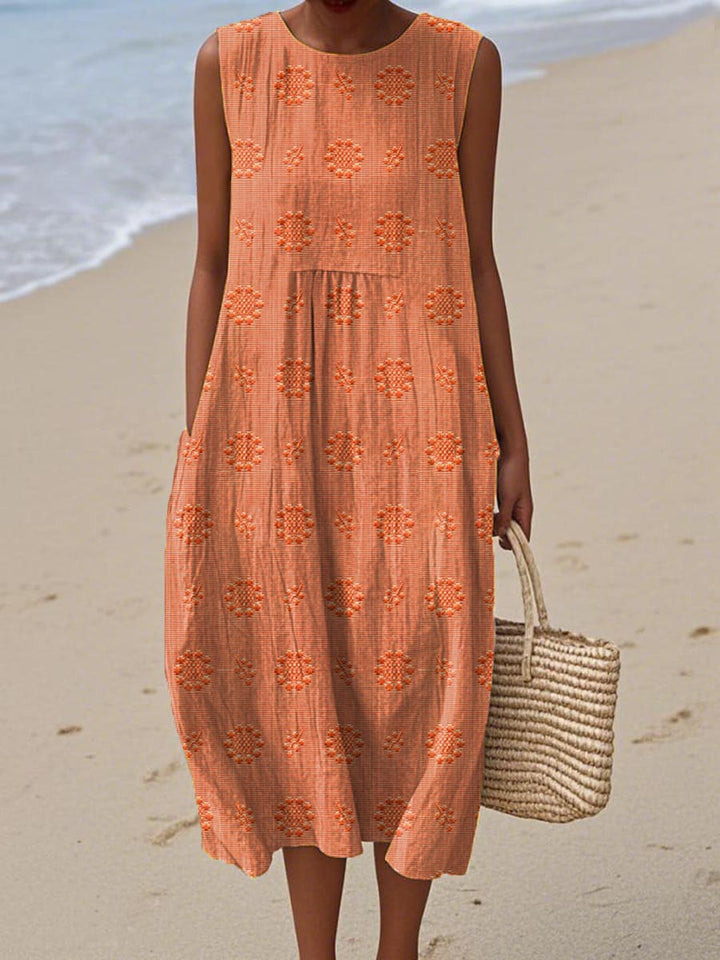 Stylish women's sleeveless summer midi dress featuring functional pockets. Enjoy flowy comfort for any warm-weather day.