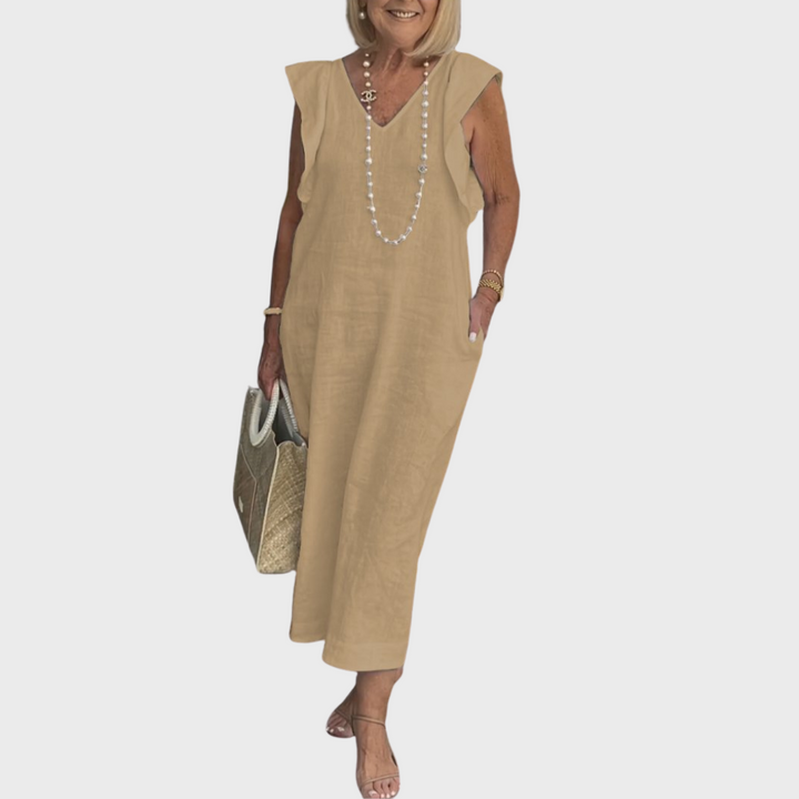 Relaxed fit women's maxi dress, sleeveless, V-neck, with stylish ruffle shoulders and practical pockets.