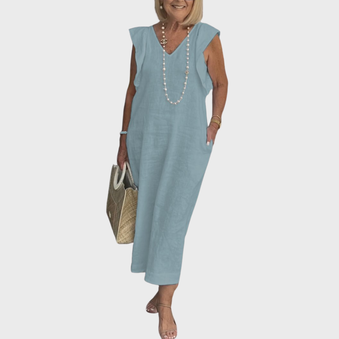 Comfortable women's summer dress. V-neck sleeveless maxi with cute ruffle shoulders and functional pockets.