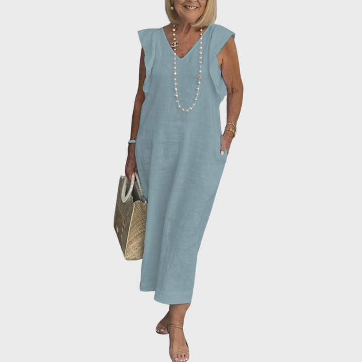 Comfortable women's summer dress. V-neck sleeveless maxi with cute ruffle shoulders and functional pockets.