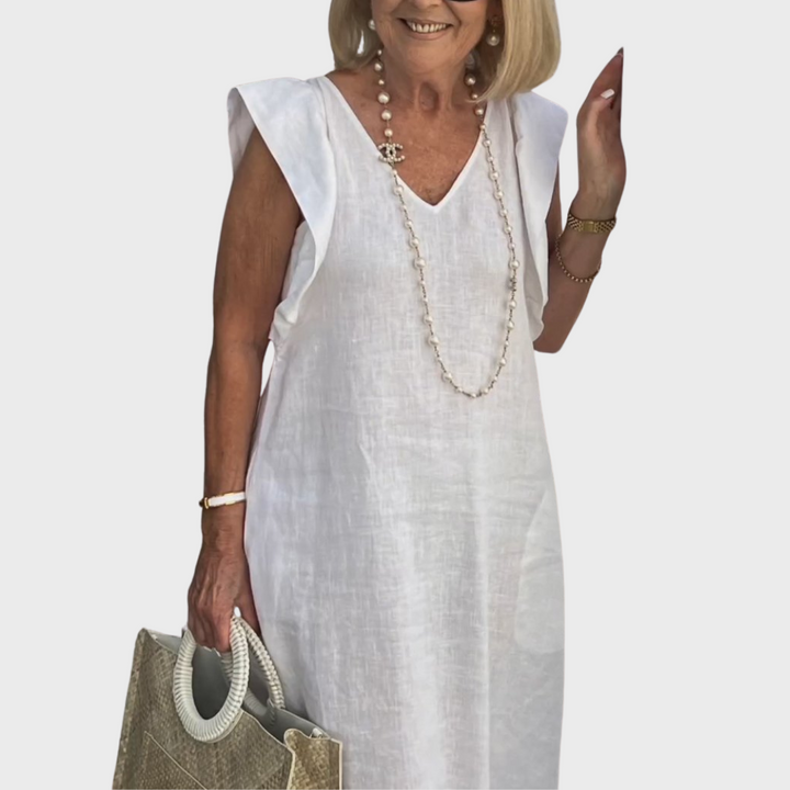Elegant flowy women's maxi dress. Features ruffle shoulder, V-neck, sleeveless design, and pockets.