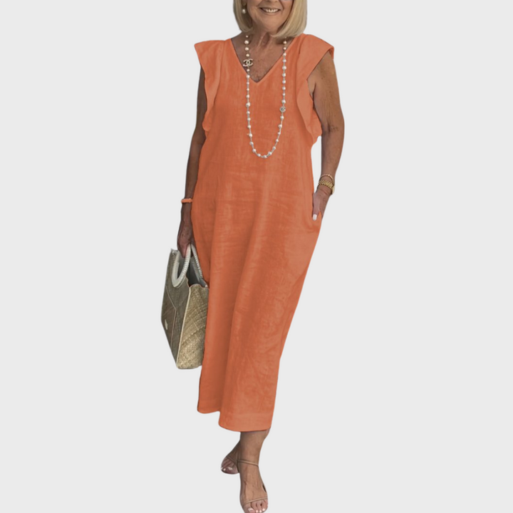Stylish women's V-neck sleeveless maxi dress with charming ruffle shoulders & functional pockets.