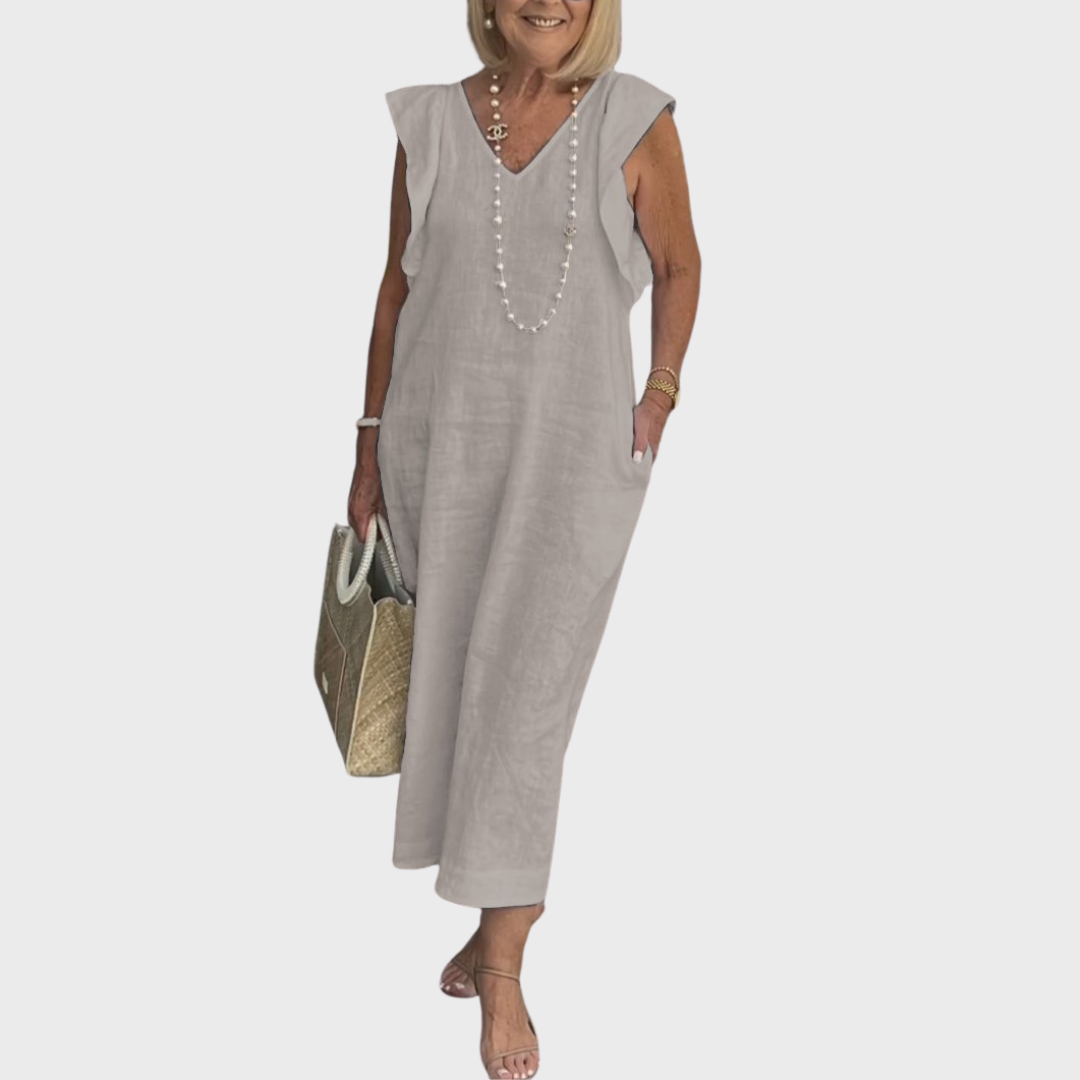 Women's sleeveless pocket maxi dress with a flattering V-neck and delicate ruffle shoulder detail.