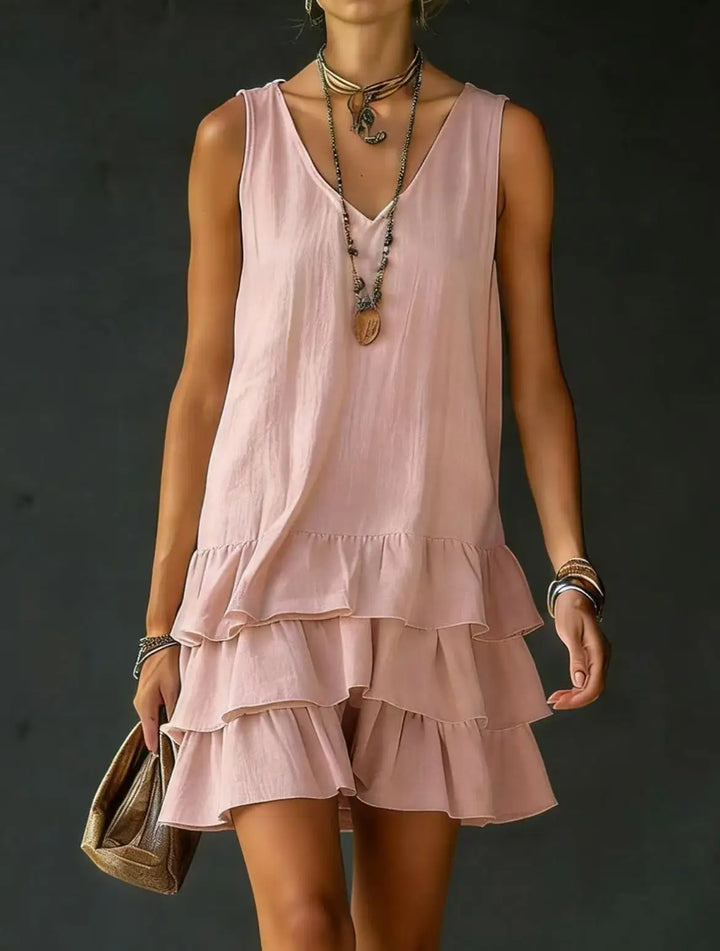 Women's sleeveless V-neck mini dress with ruffle tiers. Perfect casual summer outfit.