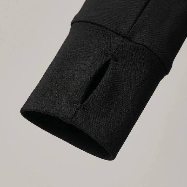 Close-up of a women's running jacket, slim fit, showcasing design for active sports & outdoor activities.