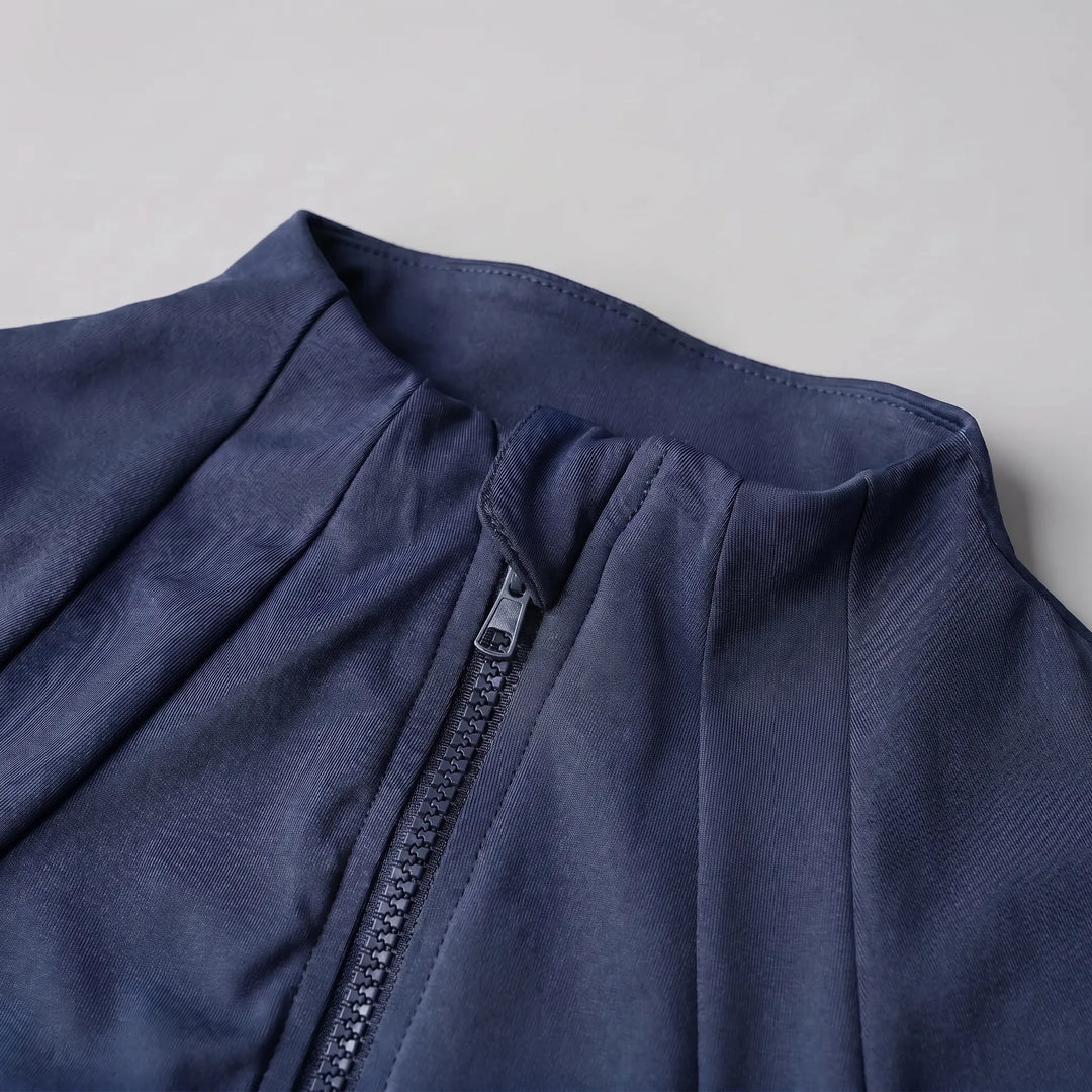 Close-up of a women's fitness jacket, slim-fit design, perfect for athletic activities and gym sessions.