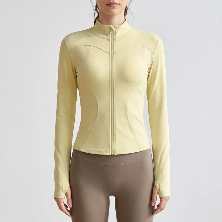 Slim-fit women's running jacket in moisture-wicking activewear fabric. Perfect for yoga and gym.