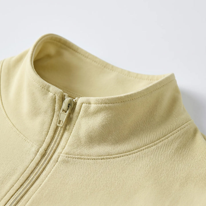 Woman in a sleek, slim-fit athletic jacket, ideal for outdoor running, yoga, and fitness activities.